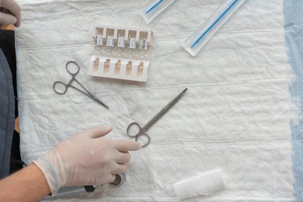 Person Holding Silver Scissors Beside White and Brown Plastic Medicine Organizer